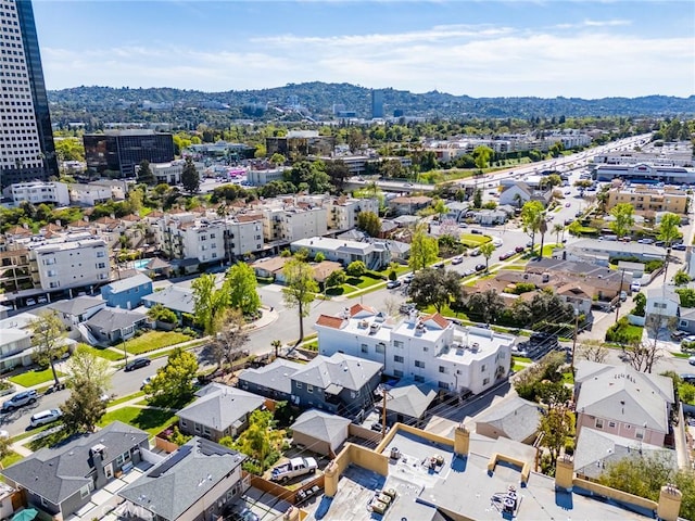 drone / aerial view featuring a view of city and a mountain view