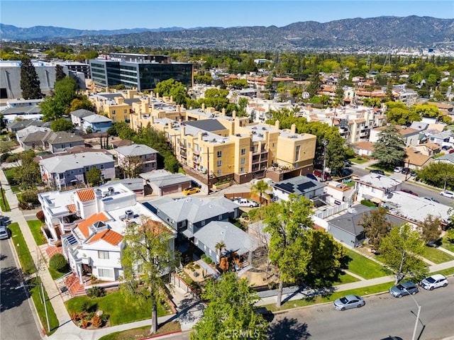 birds eye view of property featuring a mountain view