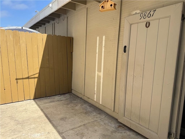 view of property exterior featuring fence