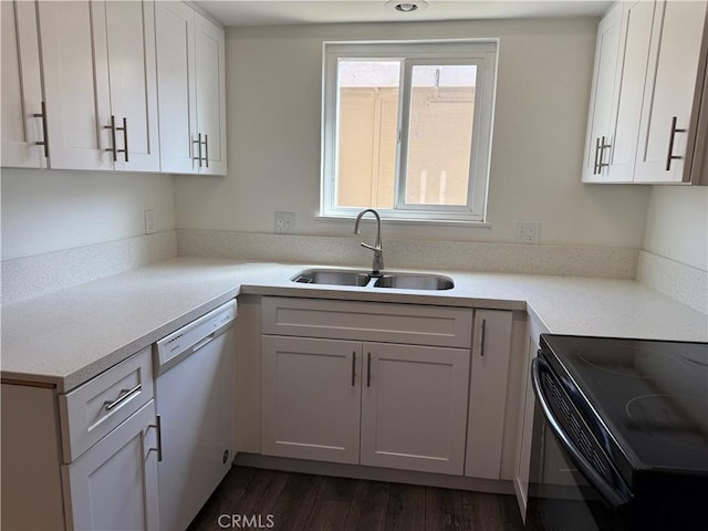 kitchen with light countertops, white cabinetry, a sink, and dishwasher