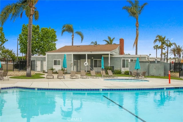 9867 Cornwall Dr, Huntington Beach, CA 92646 - community pool with fence and a patio area