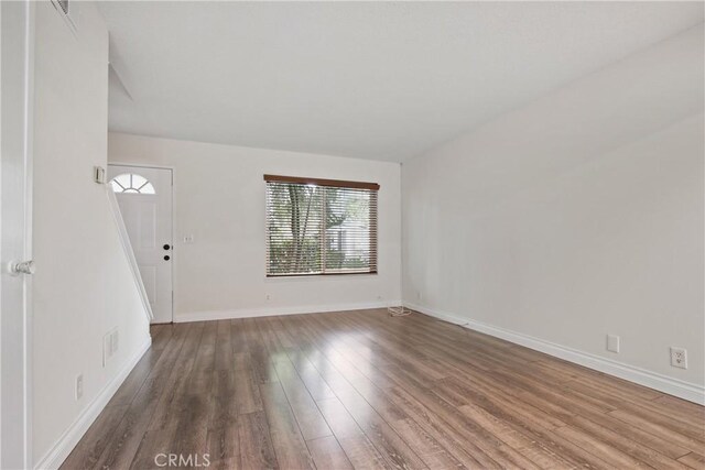 9867 Cornwall Dr, Huntington Beach, CA 92646 - unfurnished living room with wood finished floors and baseboards