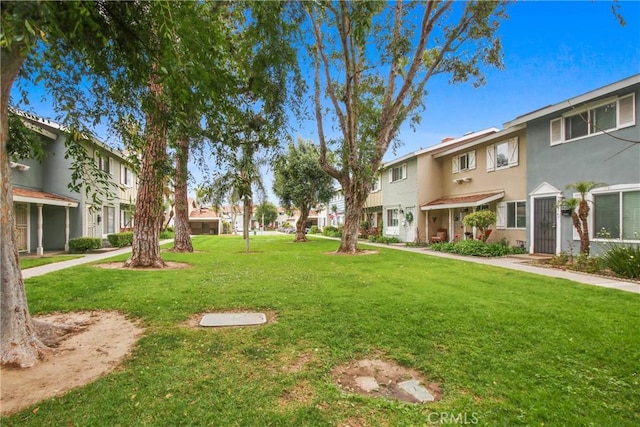 9867 Cornwall Dr, Huntington Beach, CA 92646 - view of community with a yard and a residential view
