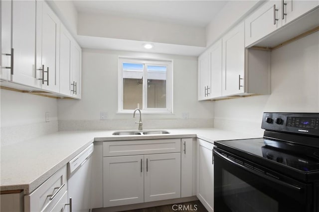 9867 Cornwall Dr, Huntington Beach, CA 92646 - kitchen with black electric range, a sink, dishwasher, light countertops, and recessed lighting