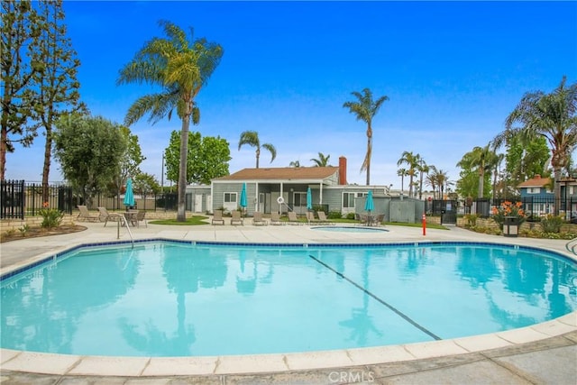 9867 Cornwall Dr, Huntington Beach, CA 92646 - community pool with fence, a patio area, and a hot tub