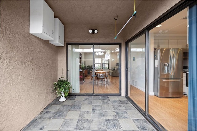 property entrance featuring stucco siding