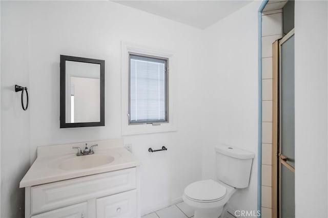 11584 Hallwood Dr, El Monte, CA 91732 - bathroom with an enclosed shower, toilet, tile patterned floors, and vanity