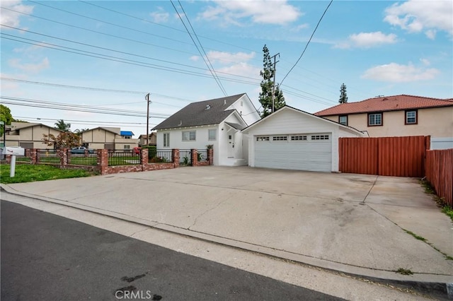 11584 Hallwood Dr, El Monte, CA 91732 - view of front of property with a detached garage, fence, a residential view, and an outbuilding