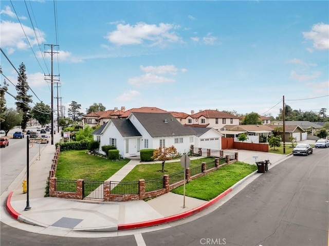 11584 Hallwood Dr, El Monte, CA 91732 - mediterranean / spanish-style home featuring a residential view, a fenced front yard, a garage, and a front yard