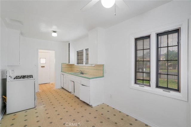 11584 Hallwood Dr, El Monte, CA 91732 - kitchen with a sink, plenty of natural light, a ceiling fan, and gas range gas stove