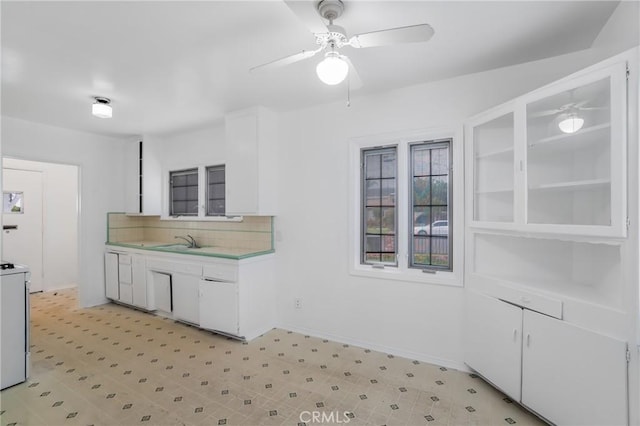 11584 Hallwood Dr, El Monte, CA 91732 - kitchen featuring baseboards, ceiling fan, light countertops, white cabinets, and tasteful backsplash