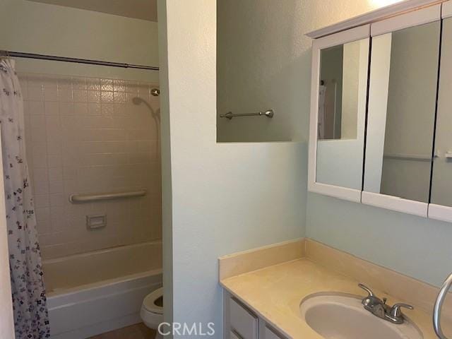 bathroom featuring vanity, toilet, and shower / tub combo with curtain