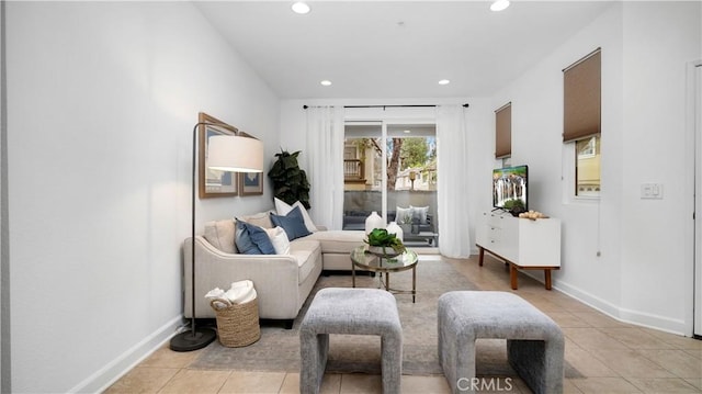 living room with recessed lighting, baseboards, and light tile patterned floors