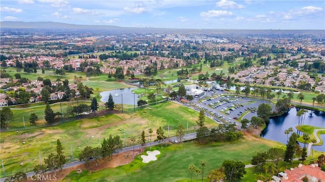 aerial view with a water view, a residential view, and golf course view