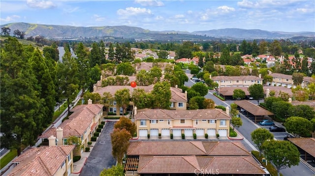 birds eye view of property with a mountain view and a residential view