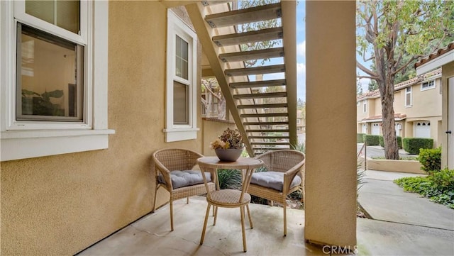 view of patio featuring stairway