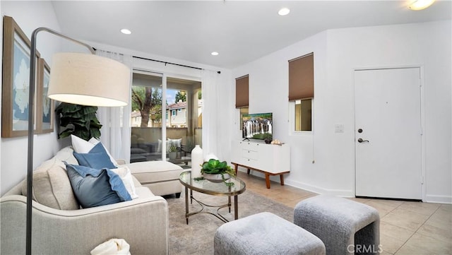 living area with recessed lighting and light tile patterned floors