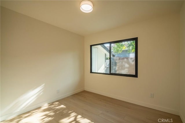 23919 Friar St, Woodland Hills, CA 91367 - spare room with light wood-style floors and baseboards