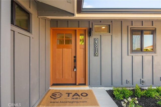23919 Friar St, Woodland Hills, CA 91367 - doorway to property featuring board and batten siding