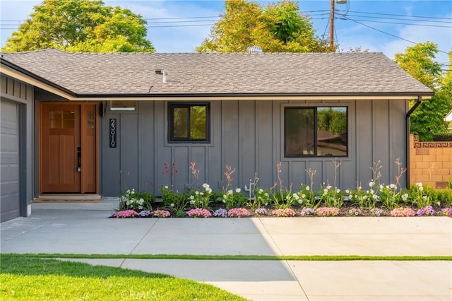 23919 Friar St, Woodland Hills, CA 91367 - view of front of property featuring board and batten siding and a shingled roof