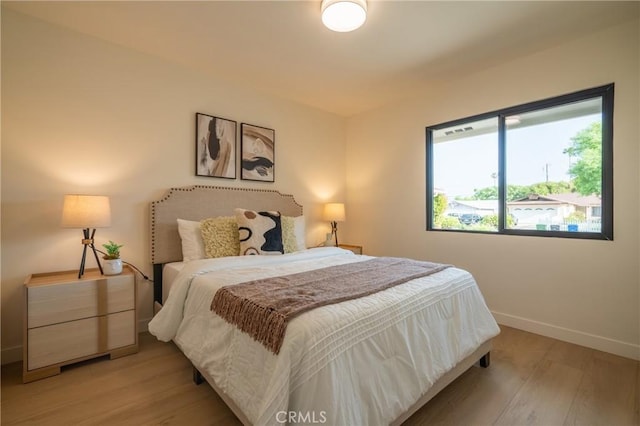 23919 Friar St, Woodland Hills, CA 91367 - bedroom featuring light wood-style flooring and baseboards