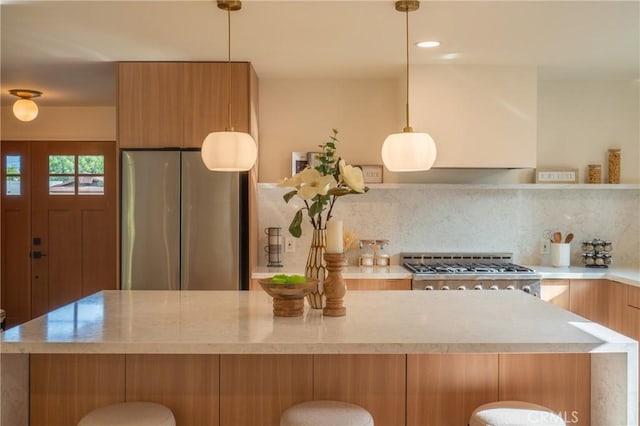 23919 Friar St, Woodland Hills, CA 91367 - kitchen with freestanding refrigerator, modern cabinets, light countertops, stove, and backsplash