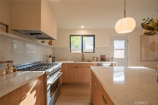 23919 Friar St, Woodland Hills, CA 91367 - kitchen featuring appliances with stainless steel finishes, extractor fan, a sink, light wood-style flooring, and light stone counters