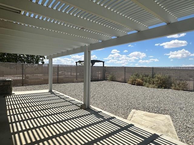 view of patio featuring a fenced backyard, a pergola, and central AC unit