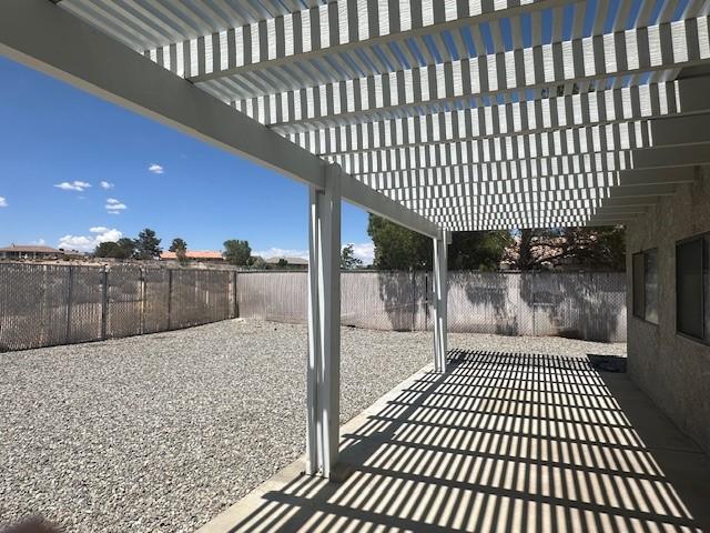 view of patio / terrace with a fenced backyard and a pergola