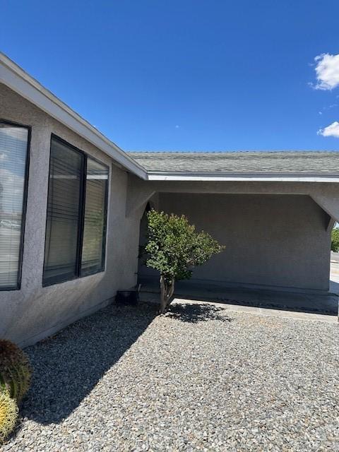 property entrance featuring stucco siding