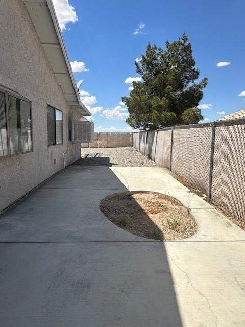 view of yard with a fenced backyard and a patio area