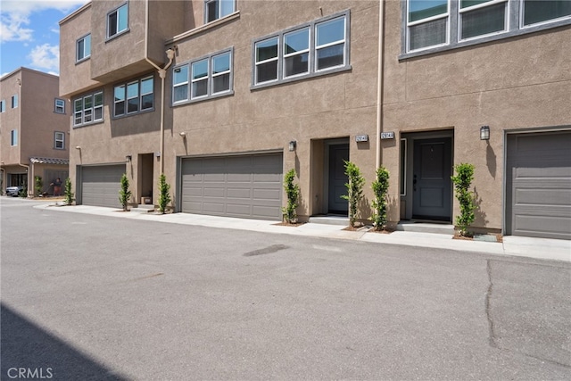 12814 Watt Ln Unit B, Sylmar, CA 91342 - exterior space featuring an attached garage and stucco siding