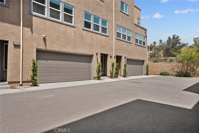 12814 Watt Ln Unit B, Sylmar, CA 91342 - view of front facade with a garage and stucco siding