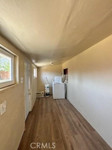 5214 Golden Ave, Riverside, CA 92505 - washroom with laundry area, washer / dryer, and wood finished floors