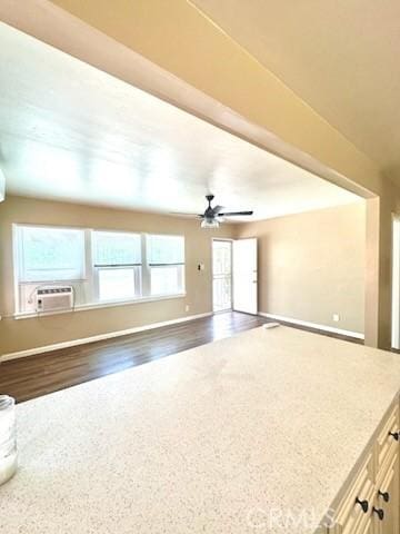 5214 Golden Ave, Riverside, CA 92505 - unfurnished living room featuring dark wood-style flooring, a ceiling fan, baseboards, and cooling unit