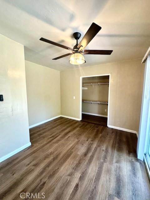 5214 Golden Ave, Riverside, CA 92505 - unfurnished bedroom with baseboards, ceiling fan, wood finished floors, and a closet