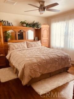 5214 Golden Ave, Riverside, CA 92505 - bedroom featuring a ceiling fan and wood finished floors
