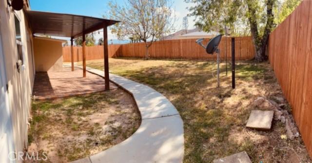 5214 Golden Ave, Riverside, CA 92505 - view of yard featuring a patio and a fenced backyard