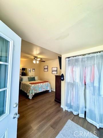 5214 Golden Ave, Riverside, CA 92505 - bedroom with ceiling fan and dark wood-type flooring