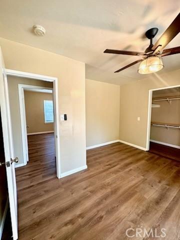 5214 Golden Ave, Riverside, CA 92505 - unfurnished bedroom featuring baseboards, a ceiling fan, wood finished floors, and a closet