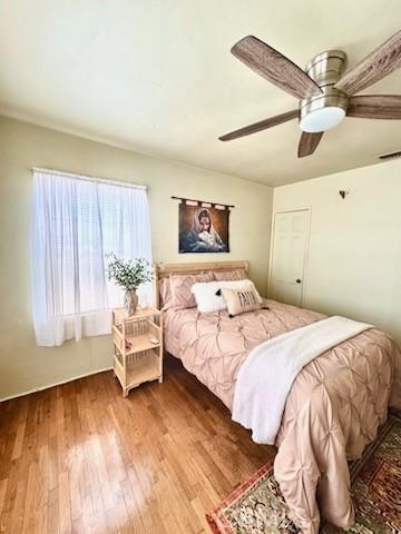 5214 Golden Ave, Riverside, CA 92505 - bedroom with ceiling fan, visible vents, and wood finished floors