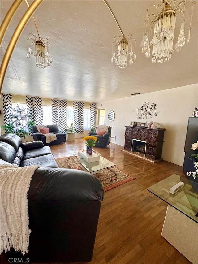 5214 Golden Ave, Riverside, CA 92505 - living area featuring wood finished floors and a chandelier