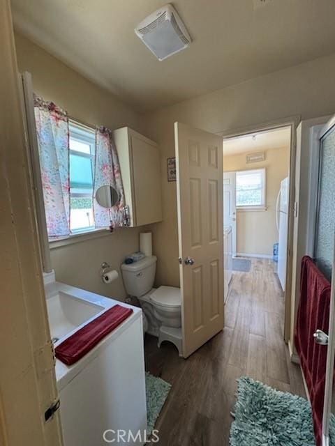 5214 Golden Ave, Riverside, CA 92505 - full bathroom featuring toilet, plenty of natural light, wood finished floors, and vanity