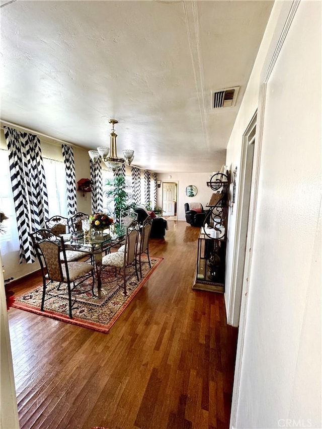 5214 Golden Ave, Riverside, CA 92505 - dining space with visible vents, a healthy amount of sunlight, and hardwood / wood-style floors