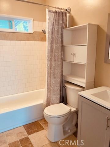 5214 Golden Ave, Riverside, CA 92505 - bathroom with vanity, toilet, and shower / tub combo with curtain