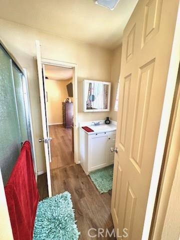 5214 Golden Ave, Riverside, CA 92505 - hall featuring a sink and wood finished floors