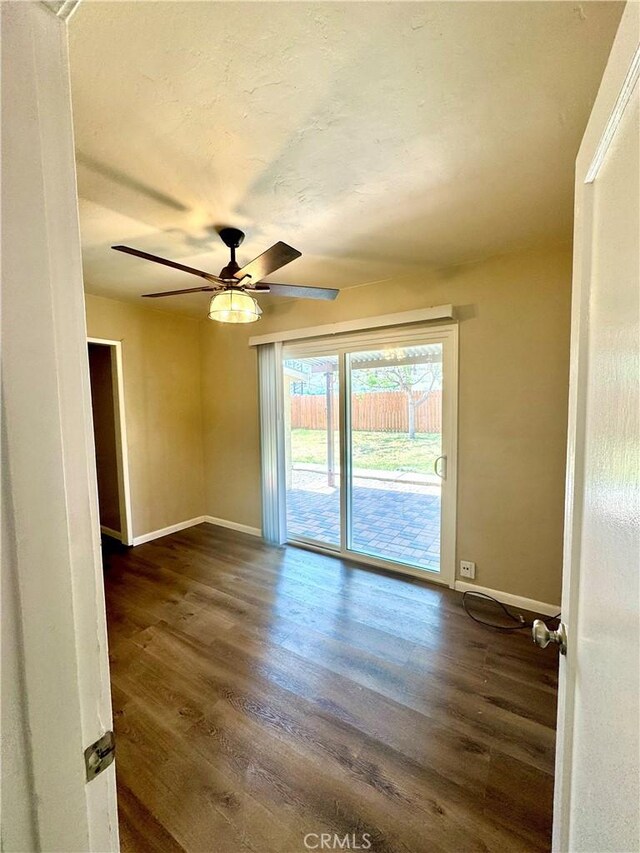 5214 Golden Ave, Riverside, CA 92505 - empty room with baseboards, ceiling fan, and dark wood-style flooring