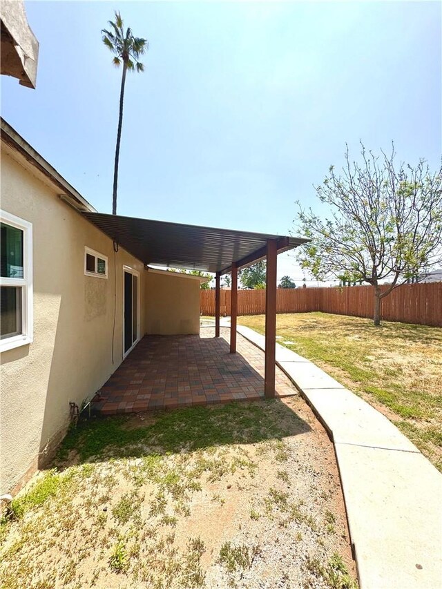 5214 Golden Ave, Riverside, CA 92505 - view of yard featuring a fenced backyard and a patio area