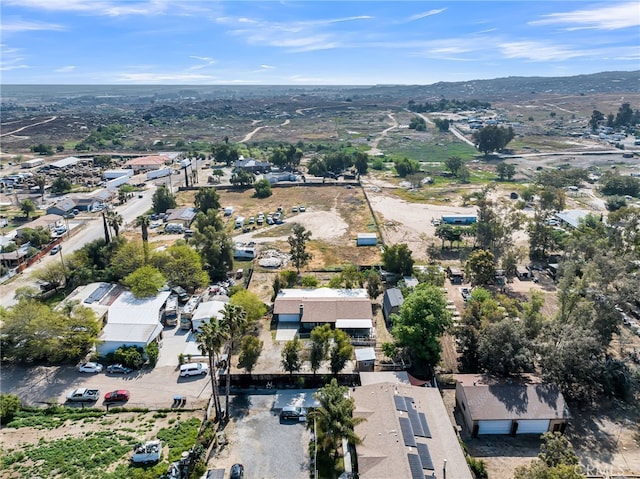 drone / aerial view featuring a residential view and a mountain view