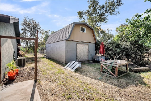 view of shed with central AC unit